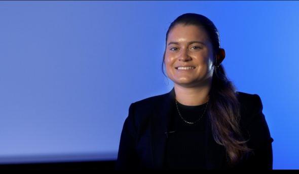 Portrait of young woman on blue background